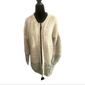 Grey and beige knitted sweater, great for cozy days in.